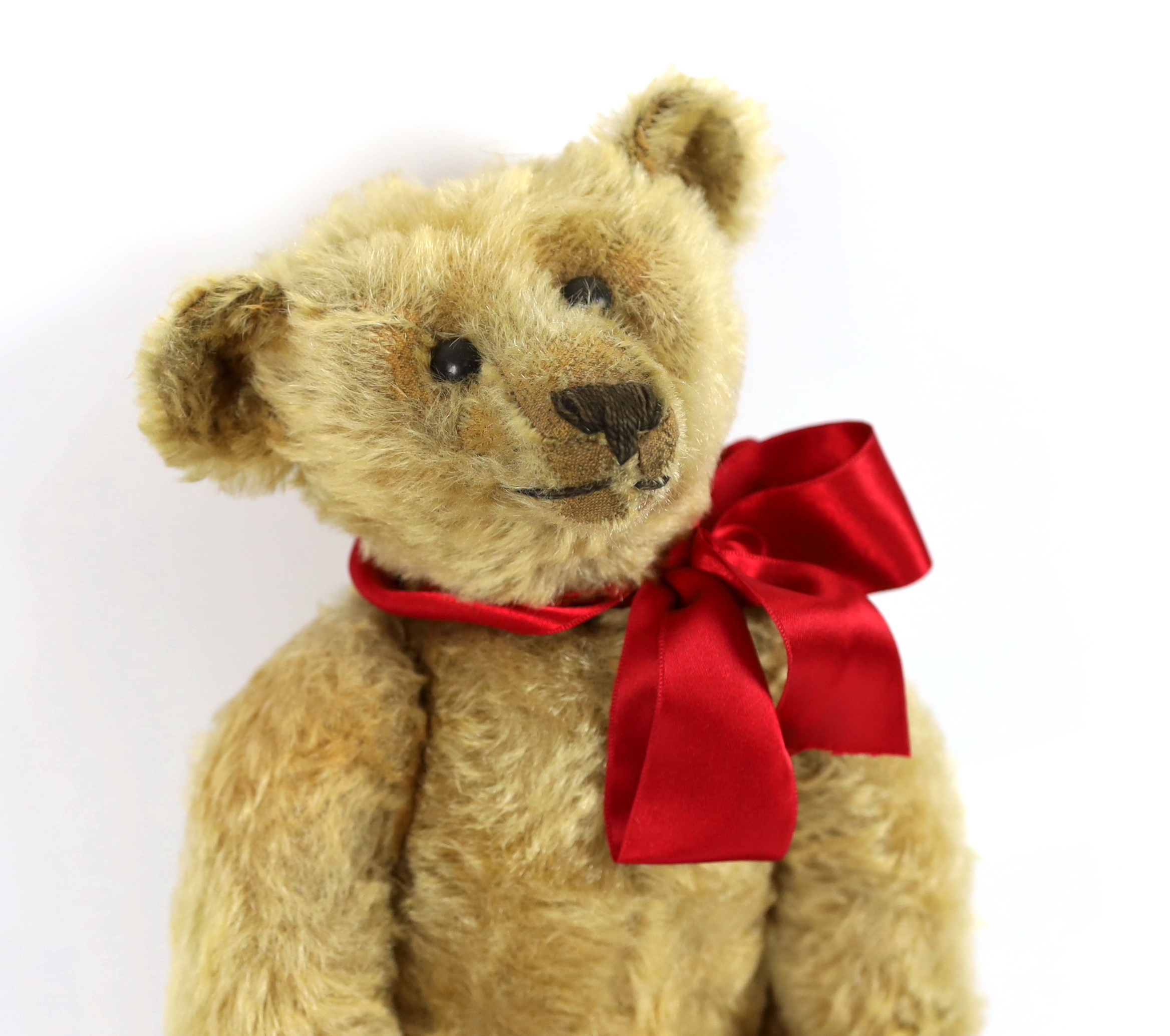 An early Steiff, c.1908, 40cm, no button, in very good condition, replaced paw pads